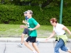 Mom chasing Dad as he runs the half-marathon