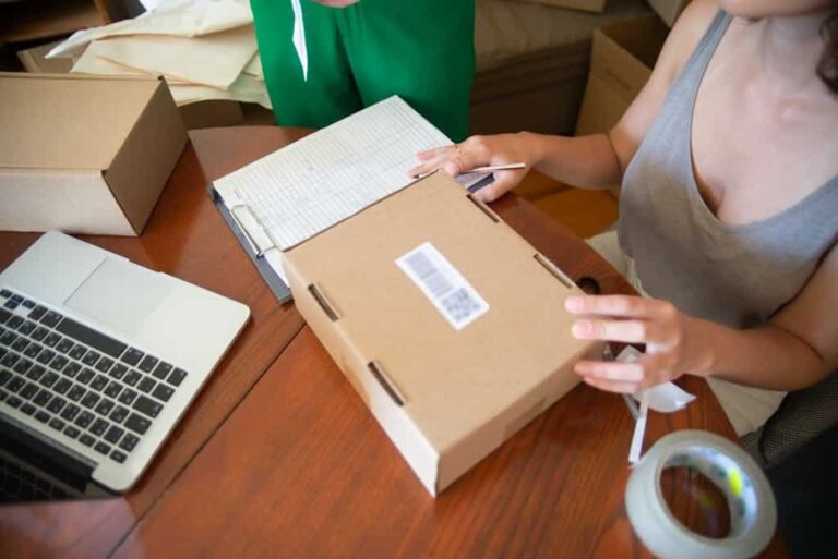 Online store owner packing orders after fixing WooCommerce checkout problems